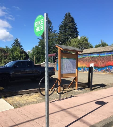 A bike hub in a paved area.