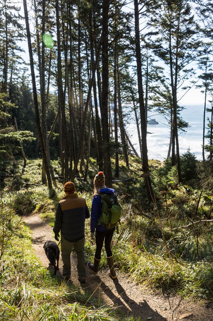 Hikers along a trail in the Oregon Coast region.